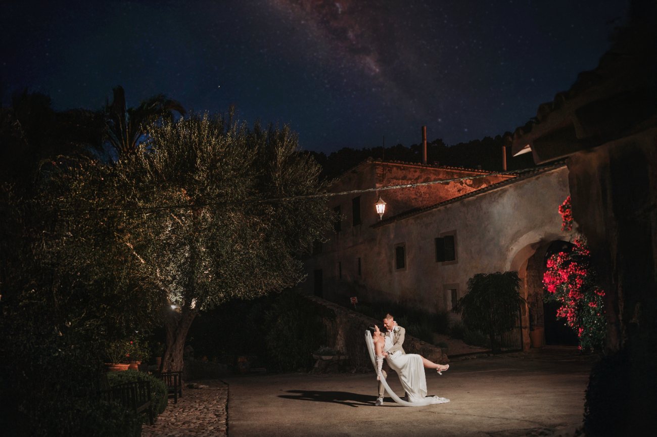 A couple embracing on their wedding day, photographed by Double Take Moments